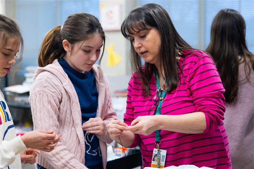 Fifth graders at Pearre Creek learn how to sew